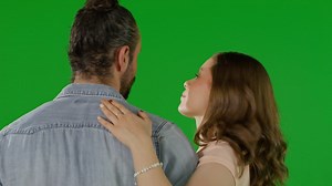 Couple sharing a tender moment against a green screen backdrop - Free Stock Video