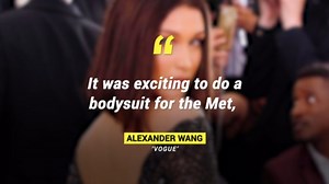 Bella Hadid Rocks Matching Snakeskin Pants and Briefcase at Dior Fashion Show