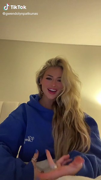 Expressive Hand Gestures in a Casual Blue Hoodie