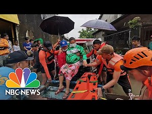 Watch: Rescuers Evacuate People From Floods In Philippines