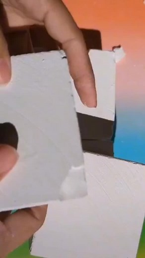 Exploring Texture: Hands Manipulating White Object