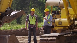 Two Workers Talking By Machinery Stock Footage Video (100% Royalty-free) 7275475 | Shutterstock