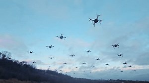 clip-3502832807-swarm-drones-flying-dusk-group-hovering-sky