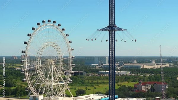 Orlando Starflyer is worlds tallest swing ride near Ferris wheel at Icon Park in Florida. USA tourist attraction