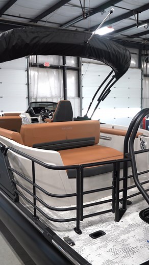 Sharp, sleek, and seriously stylish. This G series in matte black and cognac interior is a combo you just can’t beat. #BoatStyle #SylvanPontoons #LakeDays | Sylvan Marine