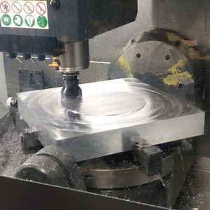 5.2M views · 433 shares | The Material Extends Past the Work Envelope, So Jacob Is Running This Facing Program to Be Able To Skim the Entire Surface with a 3.0 Kennametal StellRam ShellMill. Material Clamped With the MiteeBite OK-Vise Multi-Rail System on a HAAS UMC-750. | Titans of CNC Machining | Facebook