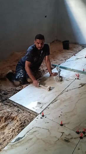 How to Install Large Marble Tiles on a Sandy Floor