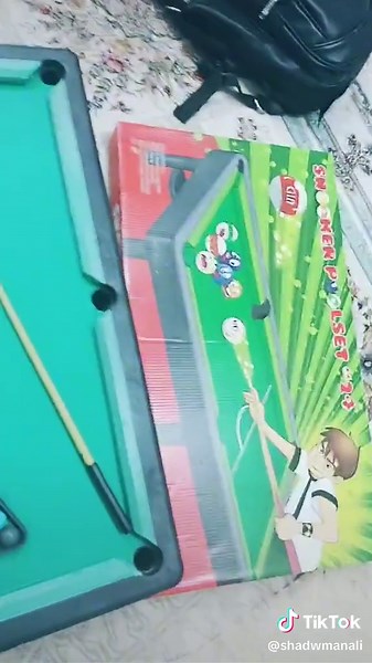 Miniature Pool Table Setup with Colorful Accessories