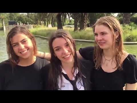 Wetlook young girls black skirts, go into a fountain