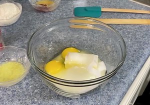 Raspberry Lemonade Bars for National Lemonade Day 1/2 cup butter, softened 3/4 cup granulated sugar 2 eggs 1 Tbsp. lemon juice 1/4 tsp. salt zest 1/2 lemon 3/4 cup all purpose flour 3/4-1 cup fresh raspberries Glaze 1 cup powdered sugar 1 Tbsp. seedless raspberry jam 1 Tbsp. lemon juice zest 1/2 lemon Preheat oven to 350 degrees. Prepare an 8x8 square pan by spraying it with non-stick spray. In a large bowl combine butter, sugar, eggs, lemon juice, salt and zest. You can mix it by hand but I use