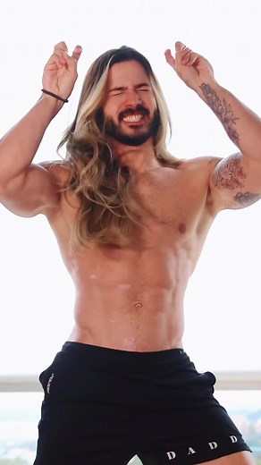 Shirtless Male Model Poses in Bright Indoor Setting