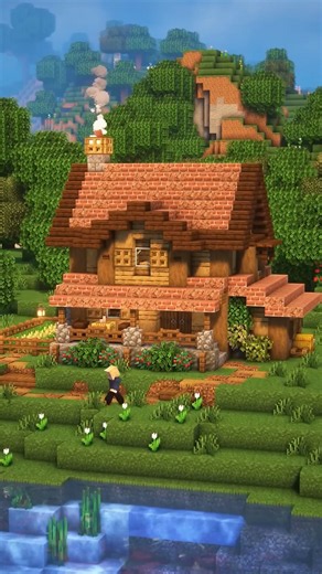 A rustic Minecraft farmhouse with garden and river views