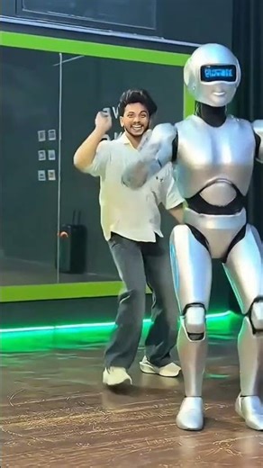 Title: Human vs Robot Dance 🔥 Future Dance Battle 🤖💃#shortfeed