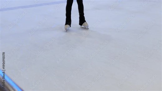 Figure skating lesson. Figure skaters training at the rink. Professional sports. Teenage figure skaters study and practice the elements on the ice.
