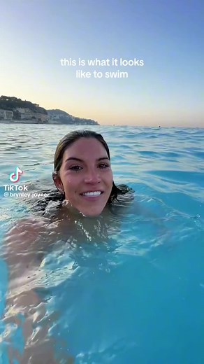 Morning Sunrise Beach Swim with Clear Blue Water