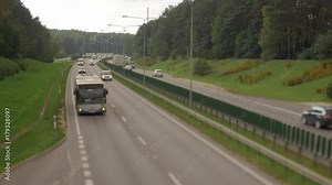 Cars running on highway down street. Four lanes two direction. Vilnius transport traffic. Blurry image. Stock Video