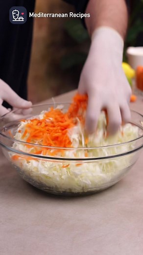 Get ready to make the best coleslaw salad of your life 🥗🤩, your taste buds won't believe what they're missing until you dive into this crisp and creamy delight. Get ready to crave coleslaw like never before! 😋👌 Preparation time: 20 minutes Serving size: 4 people Ingredients: 1 small head of white cabbage 1 tablespoon white vinegar 3 grated carrots For the dressing: 1 cup mayonnaise 1/4 cup liquid milk 1/4 cup orange juice 2 tablespoons sugar 1/4 teaspoon salt Preparation: Finely chop the cab