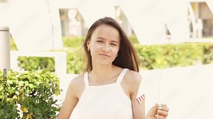 4th of july usa party, teenager girl waving the American flag, celebrating the holiday at barbecue picnics in the park