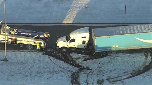 Wrecker clearing Amazon semi-trailer crash on I-35 near Moore