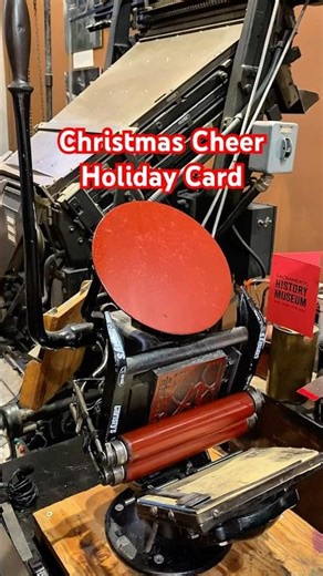 Letterpress printing some red Christmas Cheer holiday cards with a tabletop printing press