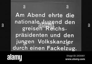 1933 - Shots of a torchlight procession to celebrate Hitler's appointment as chancellor. Hitler and Paul von Hindenburg, the president of Germany, appear behind separate windows (January 30 Stock Video Footage - Alamy