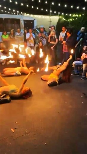 Fire dancing models putting on a show for everyone.