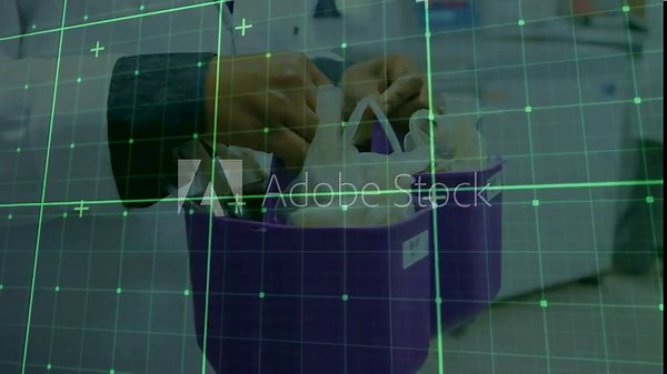 Hands reaching into purple bins, filling purple carrier with coils for transport under green grid