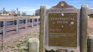A sign indicates the location of the Continental Divide in America.
