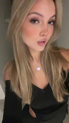 Stylish Blonde in Off-Shoulder Dress Captivates Viewers