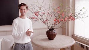 Interior stylist, creative director and author of Arranging Things, Colin King, is back and shares tips on how to style vases with florals and branches. He says you'll not only add height to a room, but you'll enhance its organic feel. Choosing the right vessel, however, determines which blooms you display. bit.ly/3UDIenk Products featured: Vintage Travertine Table, 1970s Francesco Zambon Vase, 1910, courtesy of Maison Gerard Italian Bronze Vase, 19th Century, courtesy of Ashville Fine Arts Gunn