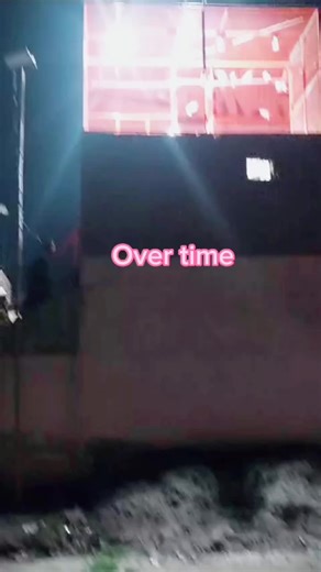 Large Rectangular Structure with Neon Sign