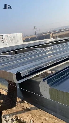 Shandong jinyao steel on Instagram: "🏠 Jinyao Steel: Polyurethane Edge-Sealed Rockwool Roof Panel Installation! 🔥 Watch our team install premium polyurethane edge-sealed rockwool roof panels—seamless insulation, sturdy protection, and perfect fit for steel factories! 🧱 These panels blend fire resistance, thermal insulation, and weatherproofing—ideal for industrial spaces needing energy efficiency & durability. Jinyao’s global one-stop service: custom design, production, worldwide shipping, an