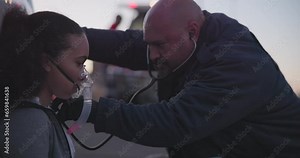 Paramedic, woman and oxygen mask with stethoscope for emergency, accident or crime scene with injury, danger or support. Anesthesia, girl or first responder with medical care, ventilation or check