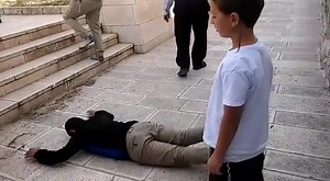 WHEN ON THE TEMPLE MOUNT - DO AS JEWS ARE COMMANDED TO DO! It is a Torah commandment to prostrate oneself while on the Temple Mount, and that's exactly what these two young men did this morning, after which they were taken off the Temple Mount by police and detained, before being let go. The reason for being removed from the Temple Mount for performing this humble act of piety? It is forbidden, by decree of the government, that any form of Jewish worship on the Temple Mount is strictly forbidden