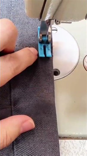 Operator Using Sewing Machine For Precision Pant Hemming Stitch