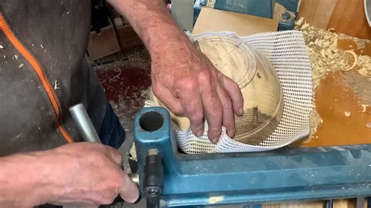 Richard Raffan carves a tripod foot on a green-turned bowl. #03