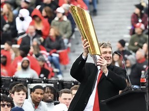 Kirby Smart accepts the CFP National Championship trophy