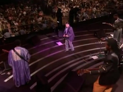 Concert in the Park 1991 series performance of "Late in the Evening" The next thing I remember I am walking down the street I’m feeling all right I’m with my boys | Paul Simon