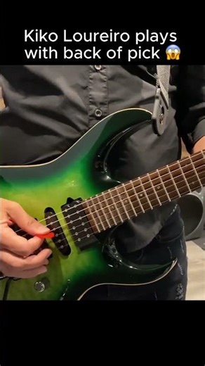 Kiko Loureiro plays with back of pick