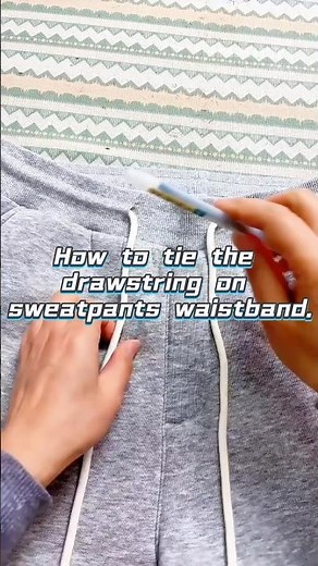 How to tie the drawstring on sweatpants waistband.