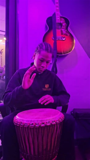 Noah learns the first pattern of Kuku on the Djembe, and adds his own variation!
