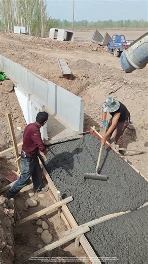 Workers Leveling Concrete for U-Shaped Canal Base - The Pre-Installation Step You Need to See