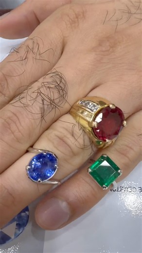 A mesmerising Cornflower Blue Sapphire and a commanding Royal Green Emerald.