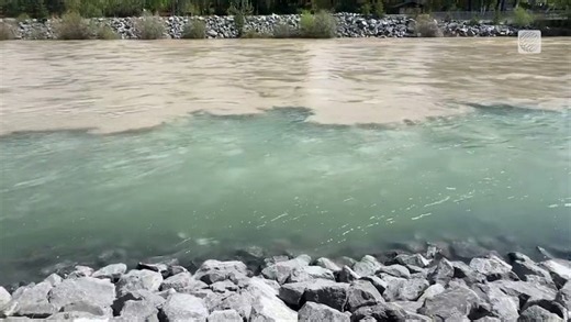 Murky spring melt visible in the Bow River in Canmore, AB