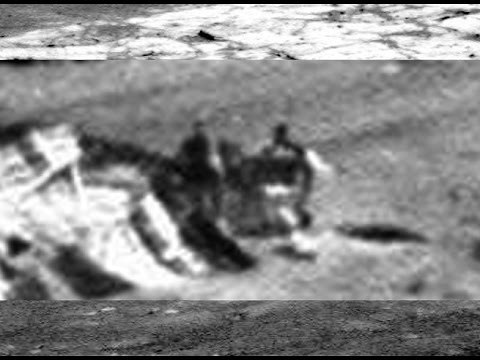 Two Figures Check Out Crashed UFO On Mars