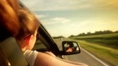 Wind Blowing Through Girl's Hair In a car. Sunset. Slowmotion