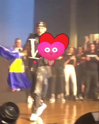 Security Officer Waving Flag at Live Event