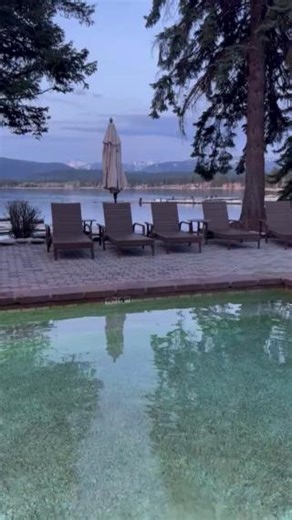 Lounging poolside with a mountain-lake view. 🏔️ We can't wait for spring evenings to start looking a little more like this. | Shore Lodge - McCall, Idaho