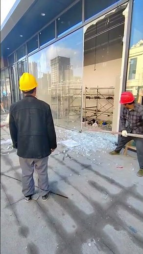 The process of removing a glass wall using a metal pipe