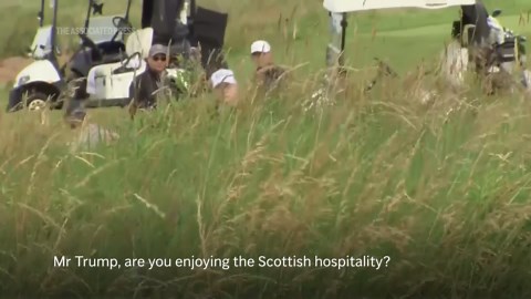 President Trump ignores questions from journalists as he plays round of golf at Scottish resort